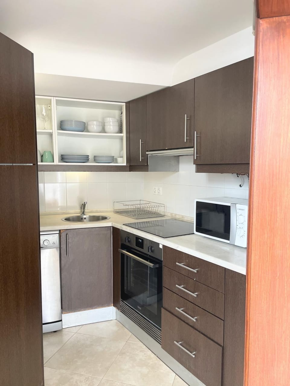 Kitchen or kitchenette, dishwasher, stove, toaster