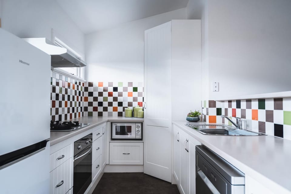 Kitchen or kitchenette, dishwasher, oven, stove, toaster