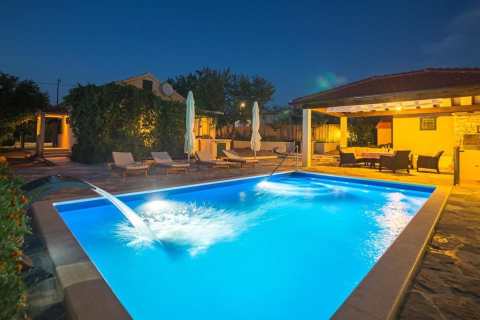 Property building, Patio, Night, Pool view, Swimming pool, sunbed