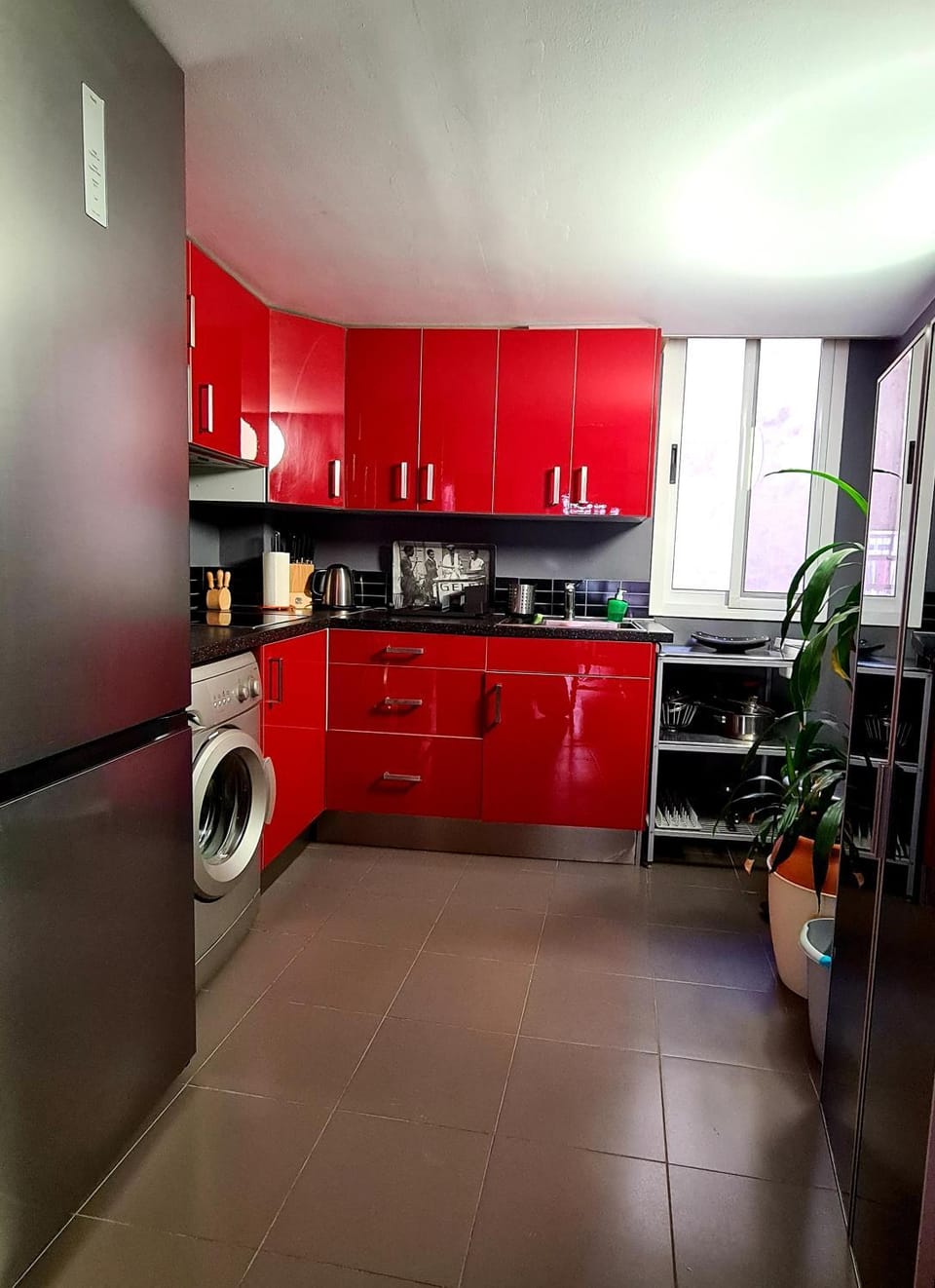 Kitchen or kitchenette, stove, toaster, washing machine
