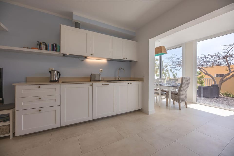 Kitchen or kitchenette, Photo of the whole room, Dining area, Garden view