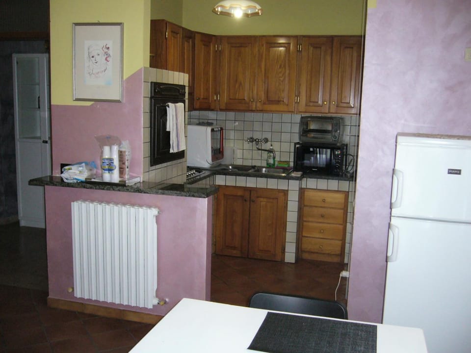 Kitchen or kitchenette, dishwasher, oven, stove, toaster