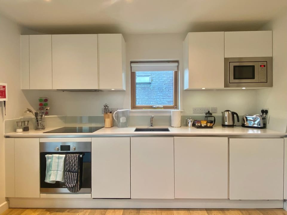 dishwasher, microwave, oven, stove, toaster, washing machine, dryer, kitchen