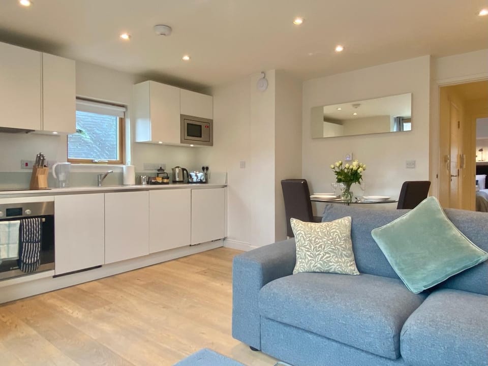 Living room, Dining area, dishwasher, microwave, oven, stove, toaster, washing machine, dryer, kitchen