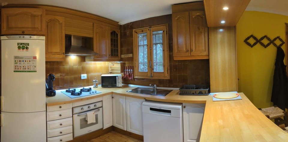 Kitchen or kitchenette, dishwasher, microwave, oven