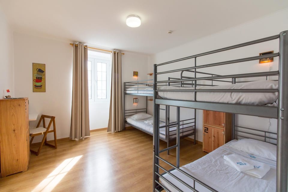 Bed, Photo of the whole room, Decorative detail, Bedroom, bunk bed, microwave, towels