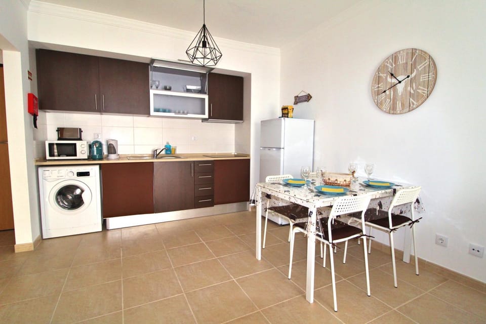 Kitchen or kitchenette, Dining area, stove, washing machine