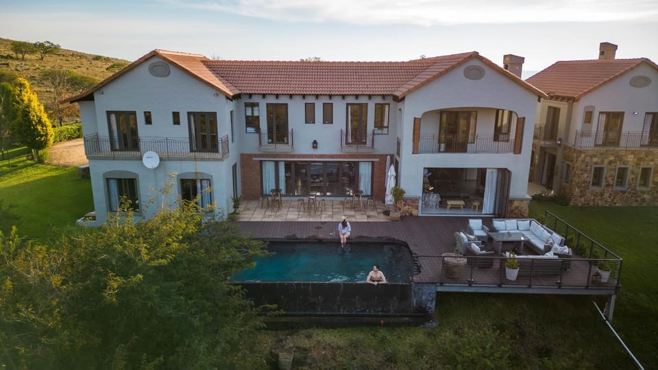 Property building, Patio, Natural landscape, Pool view, Swimming pool, sunbed