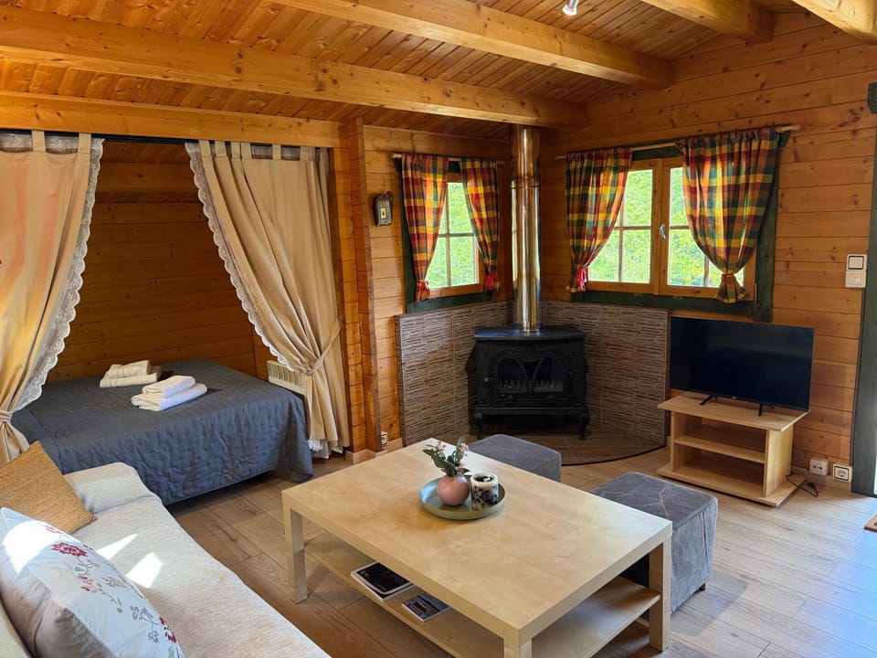 Bed, TV and multimedia, Living room, Seating area, Bedroom