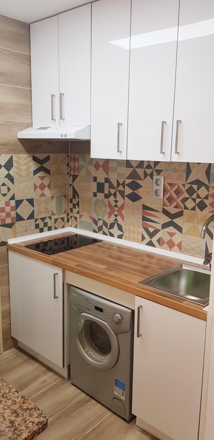 Kitchen or kitchenette, stove, washing machine