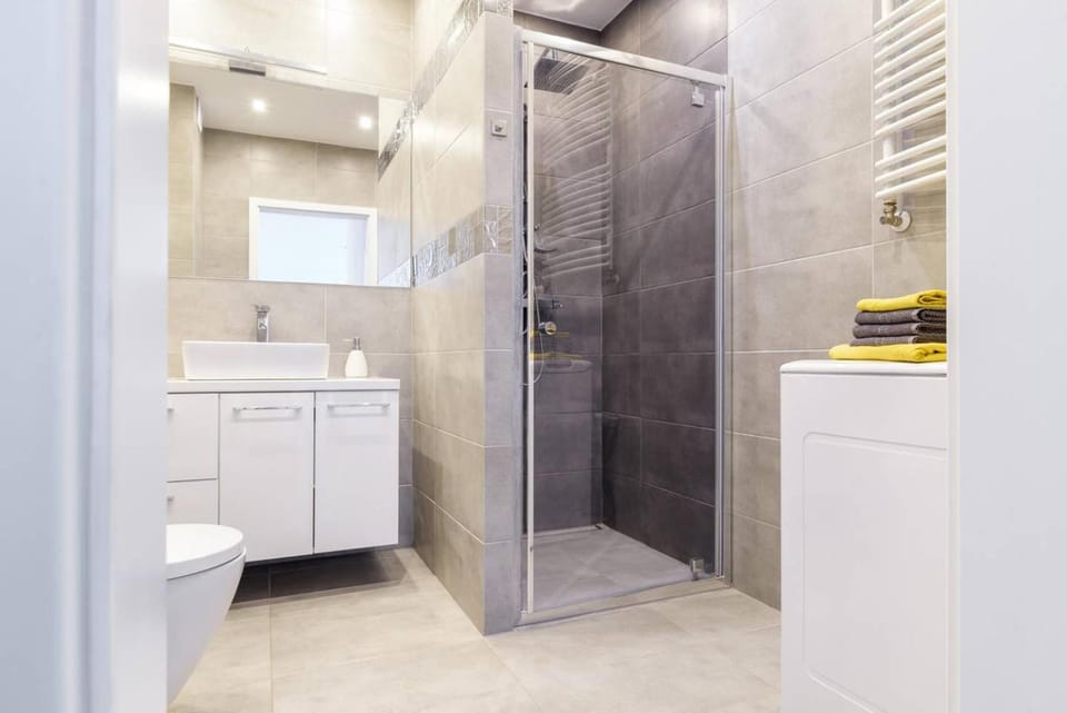 Shower, Toilet, Bathroom, flat iron, hair dryier, towels, dryer