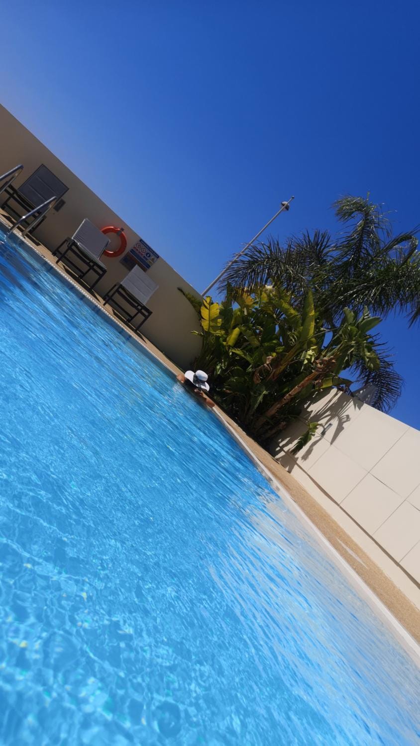 Swimming pool, sunbed