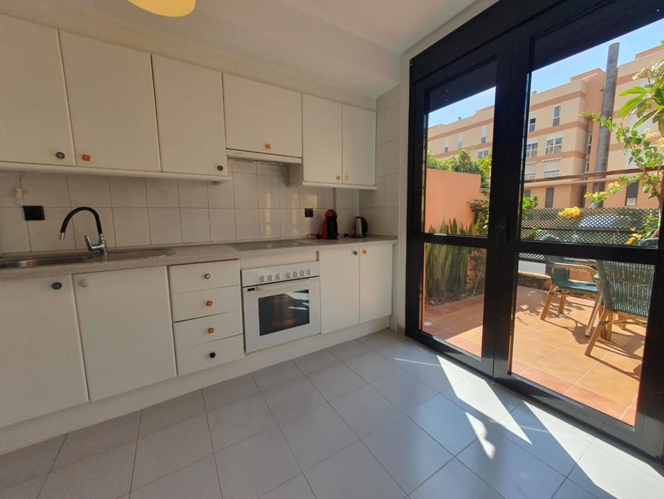 Kitchen or kitchenette, oven, stove