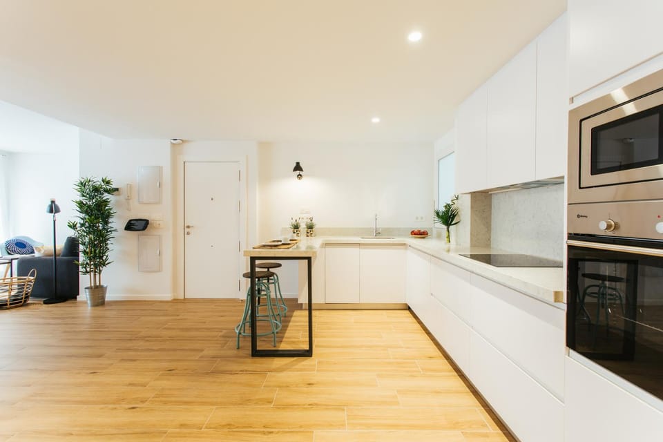 Kitchen or kitchenette, dishwasher, oven, stove