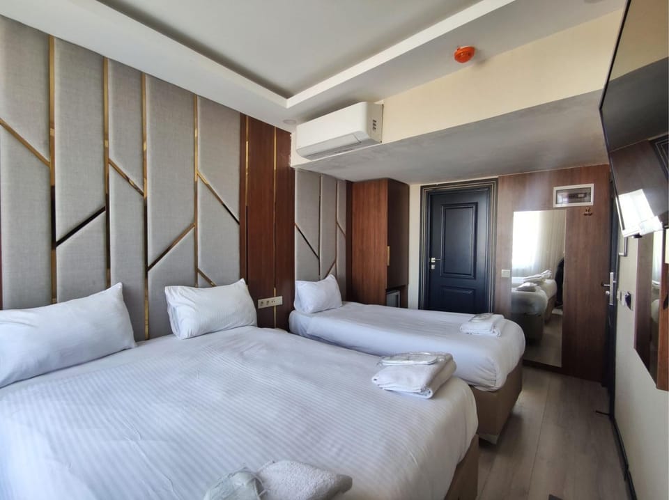 Bed, towels, wardrobe, air conditioner