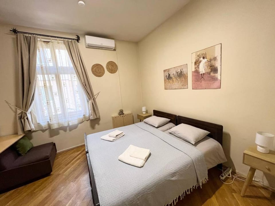 Photo of the whole room, Bedroom, towels, air conditioner