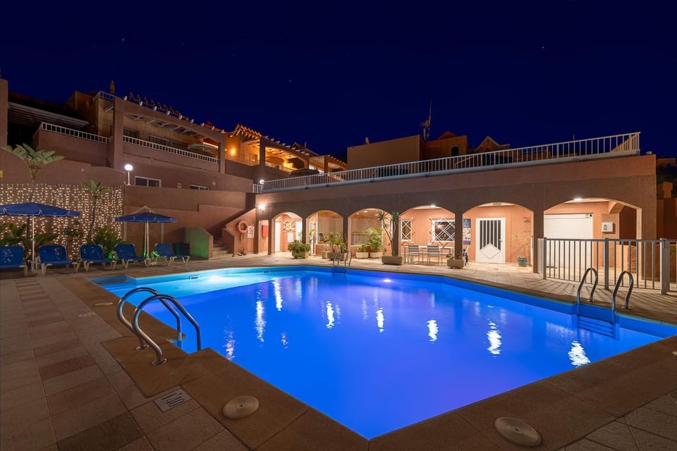 Property building, Night, Pool view, Swimming pool, sunbed