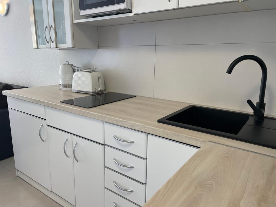 Kitchen or kitchenette, stove