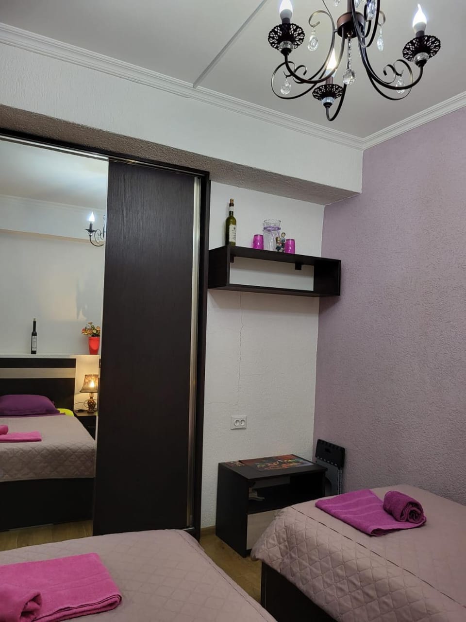 Bed, towels, wardrobe