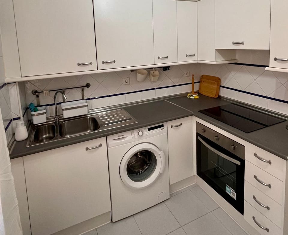 Kitchen or kitchenette, oven, stove, washing machine, kitchen