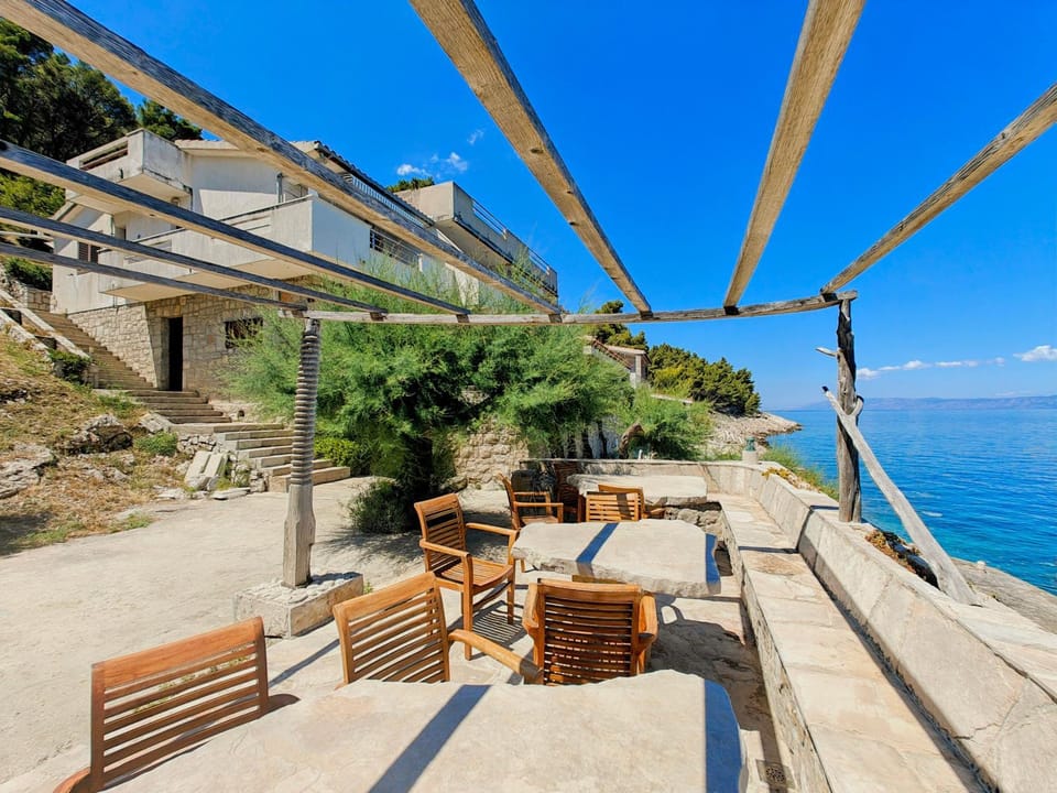 Property building, Patio, View (from property/room), Balcony/Terrace, Seating area, Sea view