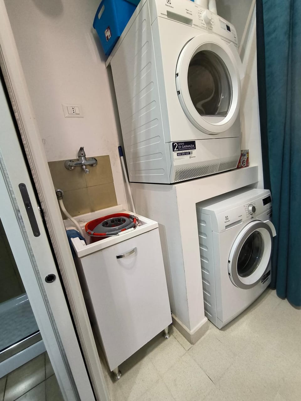 Kitchen or kitchenette, laundry, washing machine, dryer
