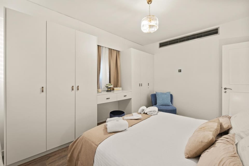 Bed, Bedroom, hair dryier, towels, air conditioner