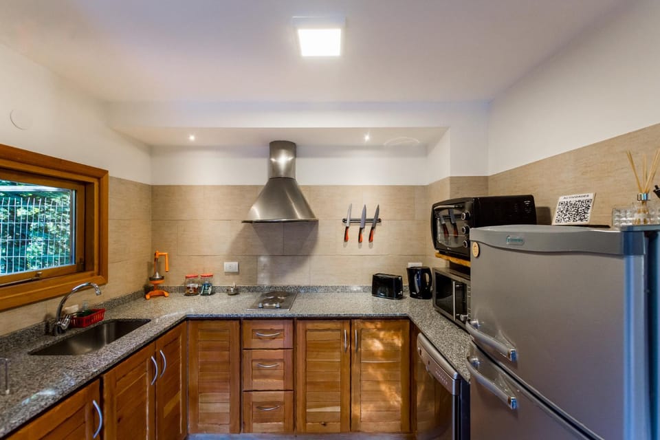 Kitchen or kitchenette, dishwasher, microwave, oven, stove, toaster
