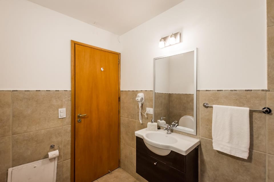 Toilet, Bathroom, hair dryier, towels