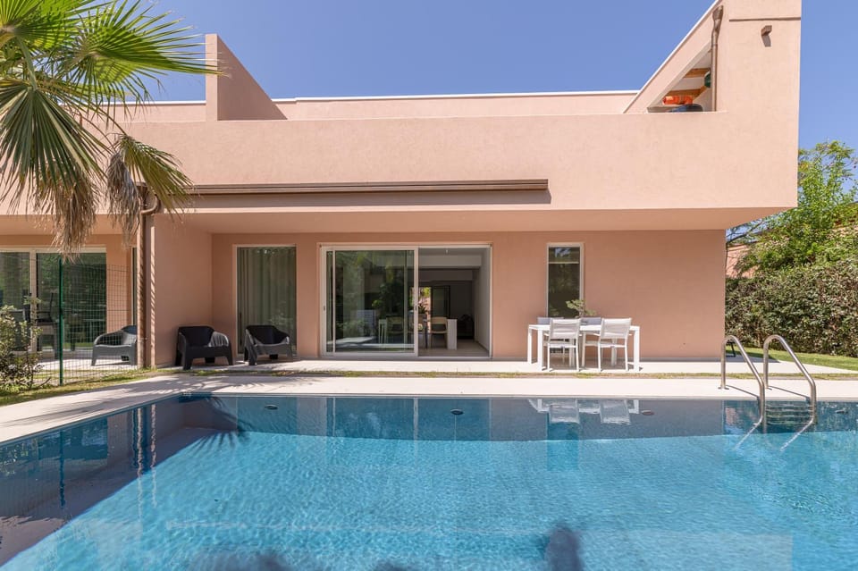 Property building, Patio, Swimming pool, sunbed