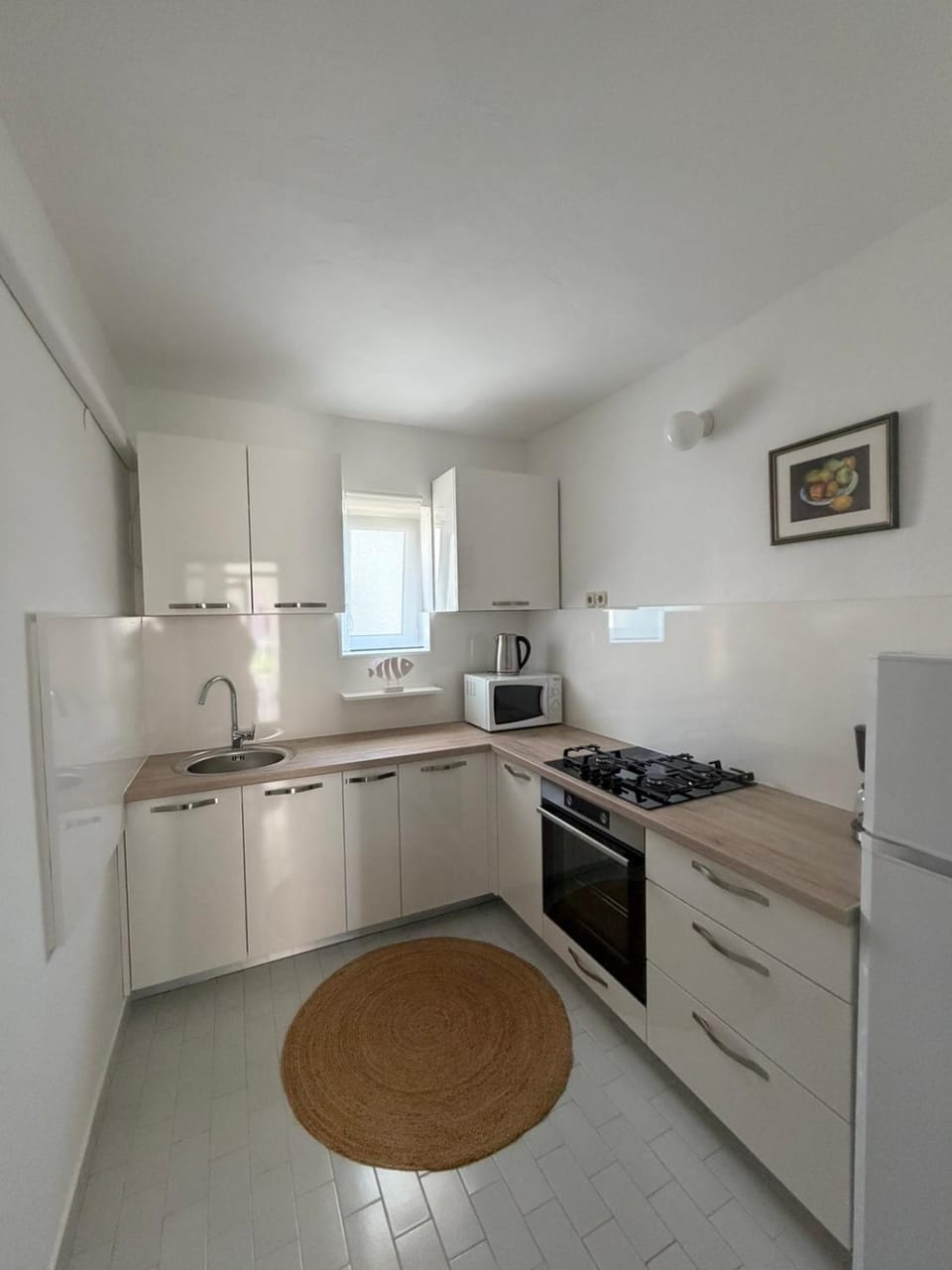 Kitchen or kitchenette, dishwasher, oven, stove, toaster
