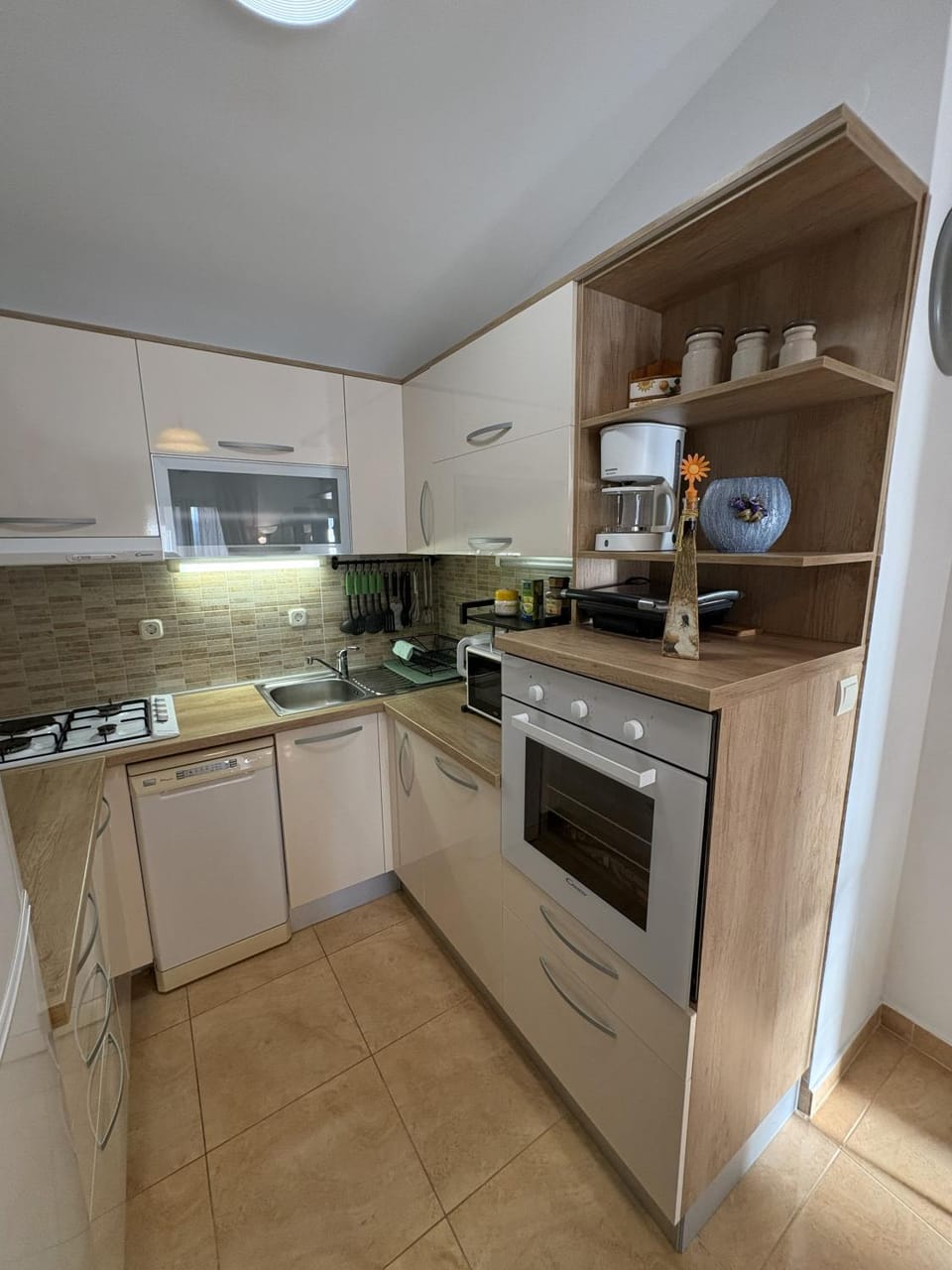 Kitchen or kitchenette, dishwasher, oven, stove, toaster