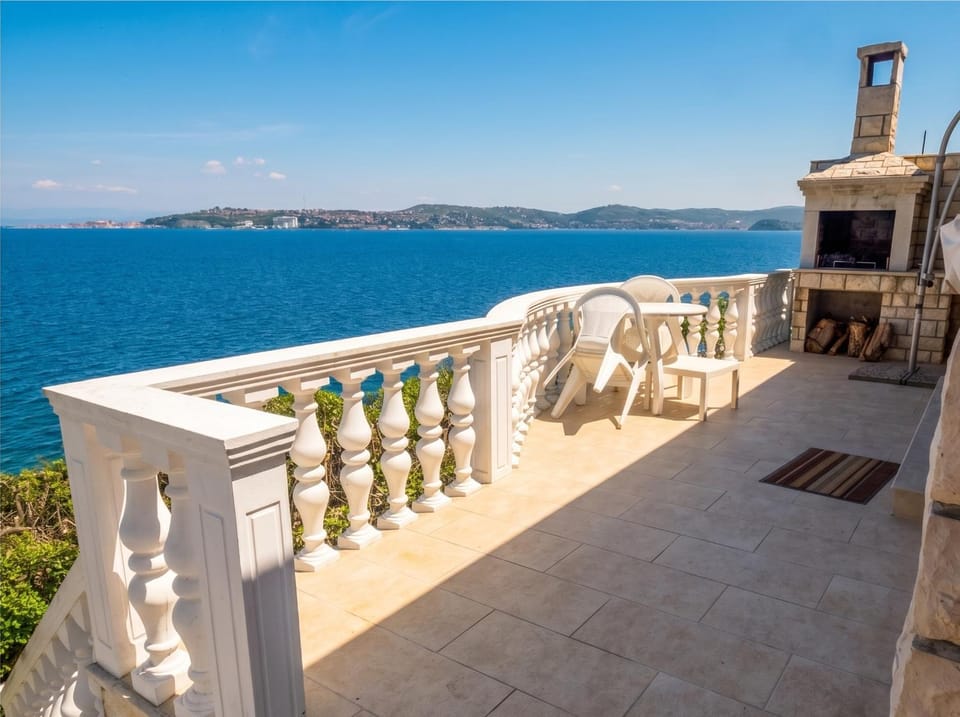 Property building, Patio, Nearby landmark, Day, Natural landscape, View (from property/room), Balcony/Terrace, Sea view