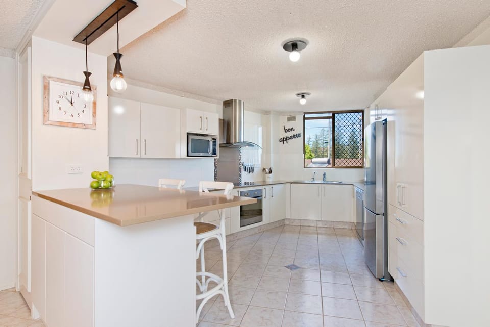 Kitchen or kitchenette, dishwasher, oven, stove