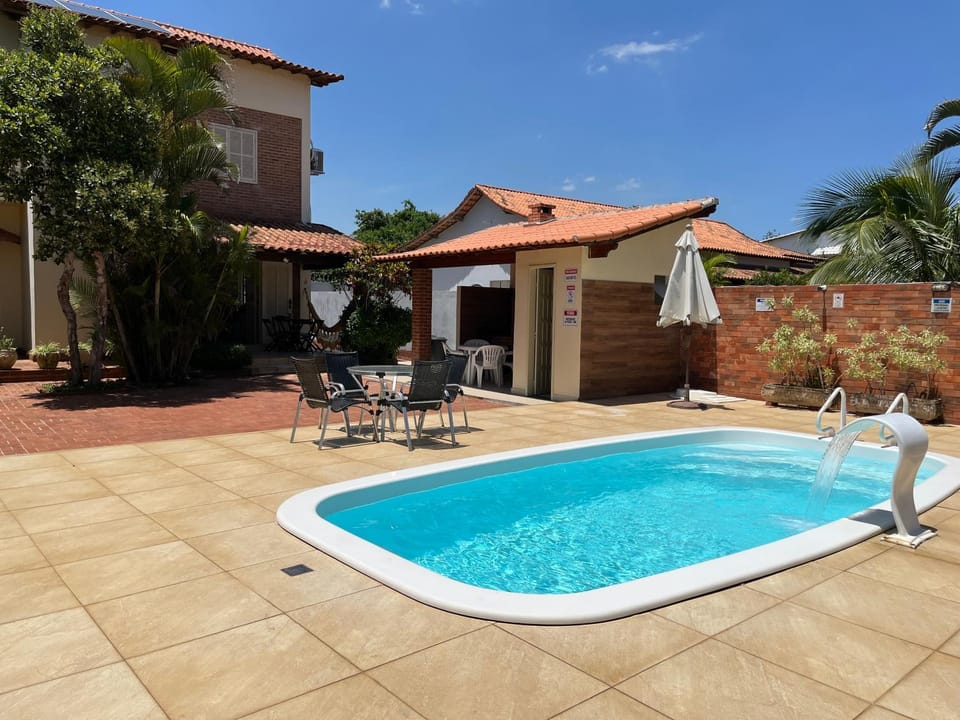 Property building, Patio, Day, Natural landscape, Pool view, Swimming pool, Swimming pool, sunbed