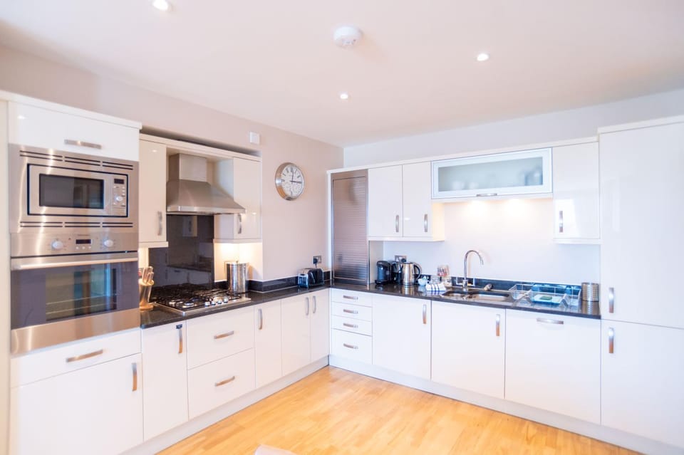 Kitchen or kitchenette, dishwasher, oven, stove, toaster