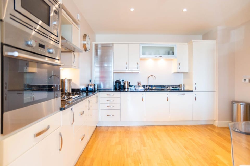 Kitchen or kitchenette, dishwasher, stove, toaster