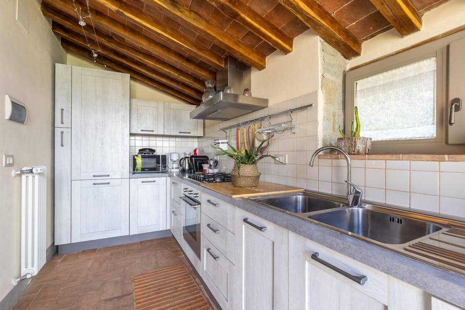 Kitchen or kitchenette, dishwasher, microwave, oven, stove, toaster