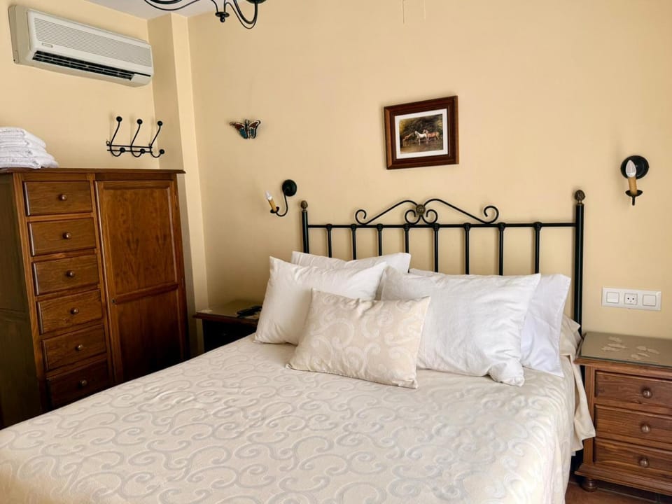 Bed, Photo of the whole room, Bedroom, towels, air conditioner
