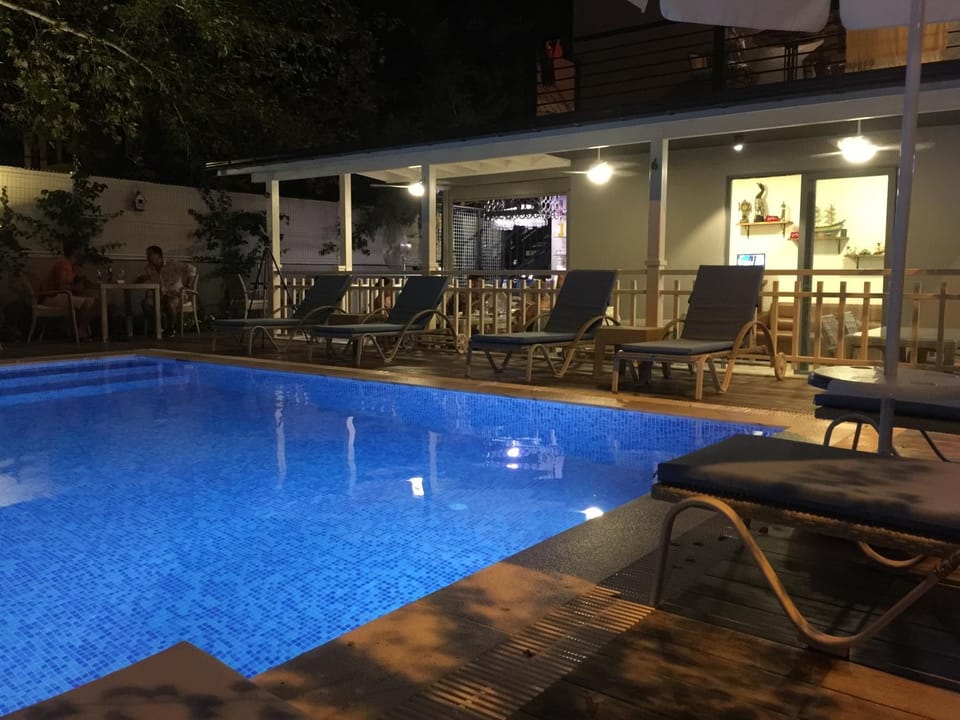 Property building, Patio, Night, Pool view, Swimming pool, Breakfast, sunbed