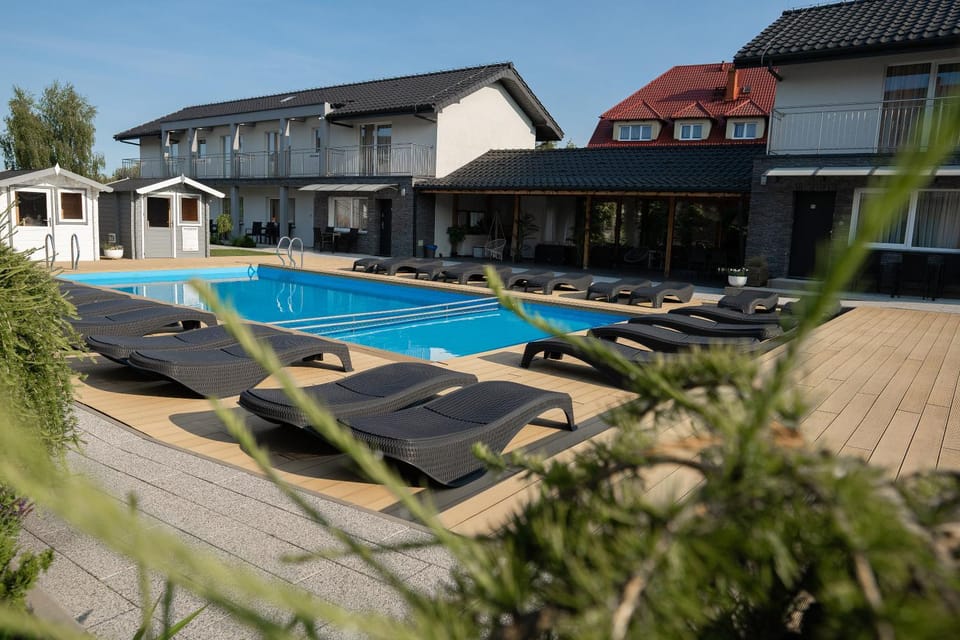 Property building, Day, Pool view, Swimming pool, sunbed