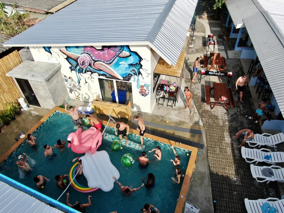 Communal lounge/ TV room, Facade/entrance, Bird's eye view, Balcony/Terrace, Decorative detail, Swimming pool, group of guests