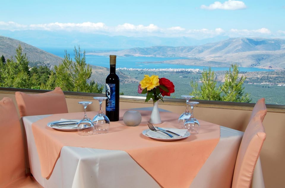Property building, Natural landscape, View (from property/room), Food and drinks, Dining area, Sea view, Breakfast, Lunch, Dinner, Sunset