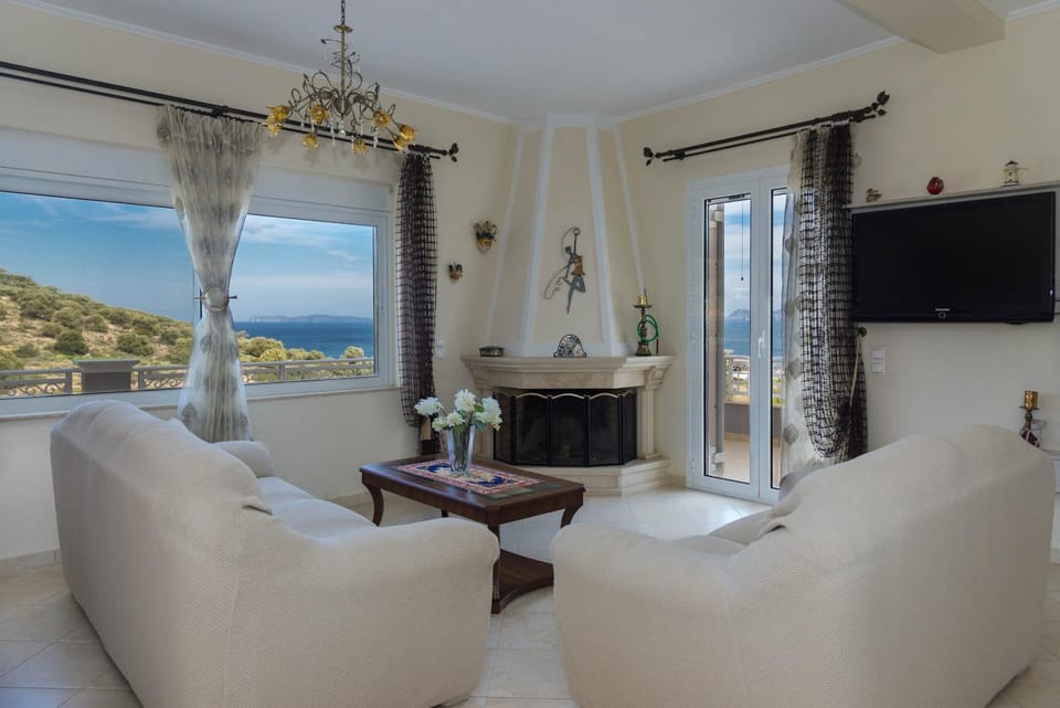 Communal lounge/ TV room, TV and multimedia, Living room, Seating area, Sea view