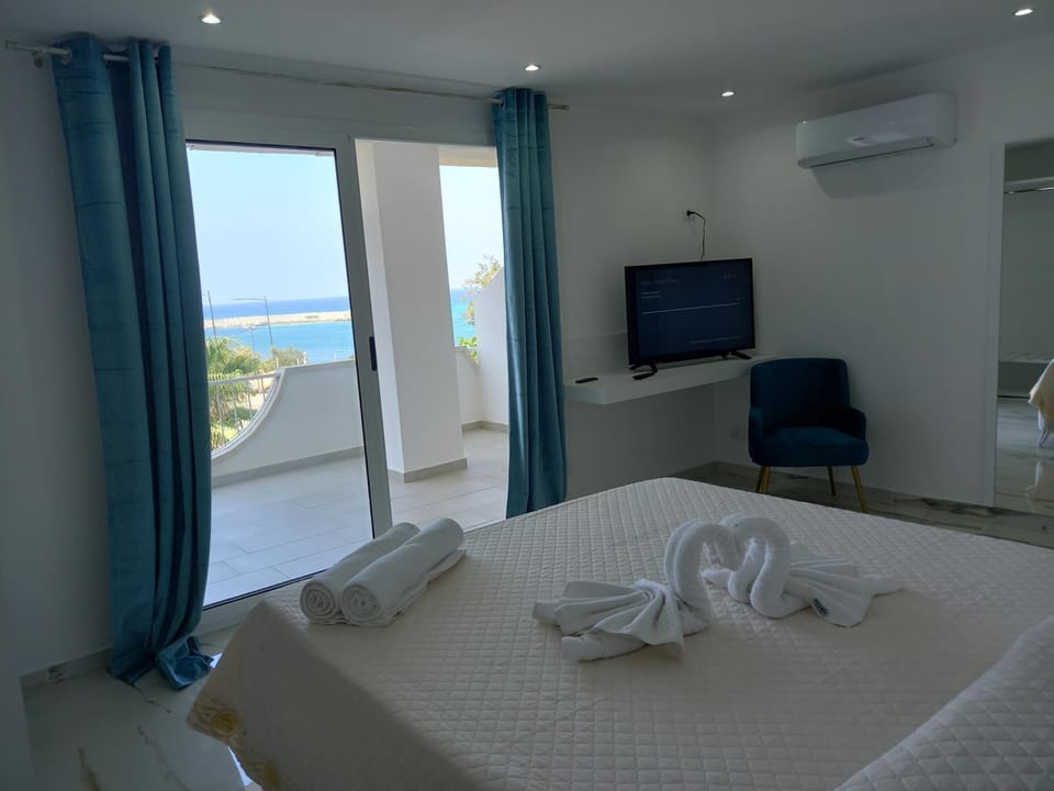 Photo of the whole room, Bedroom, Sea view, towels, air conditioner