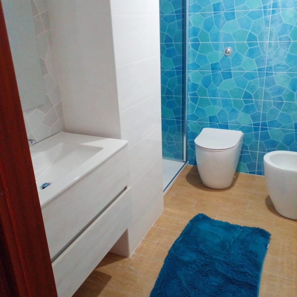 Shower, Toilet, Bathroom, bidet, towels, air conditioner