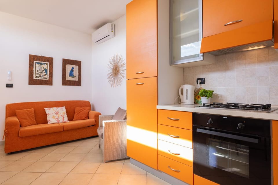 Kitchen or kitchenette, Living room, Seating area, oven, stove, air conditioner