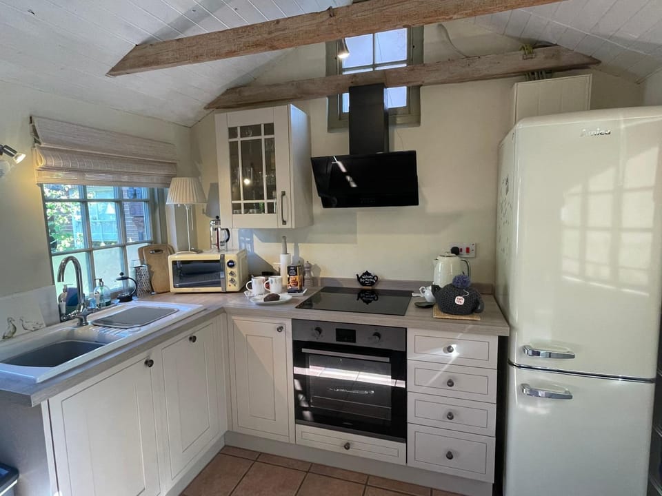 Kitchen or kitchenette, dishwasher, oven, stove, toaster