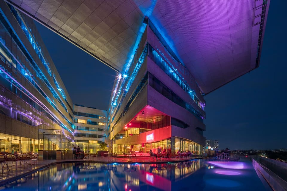 Property building, Night, View (from property/room), Pool view, Swimming pool