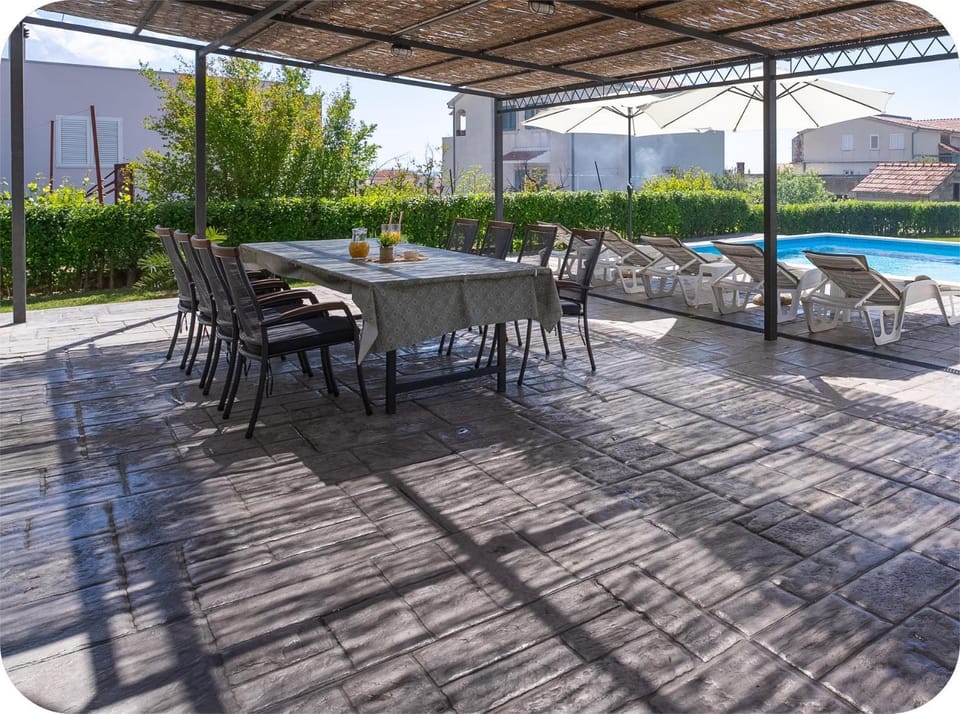 Patio, Living room, Seating area, Pool view, Swimming pool, sunbed